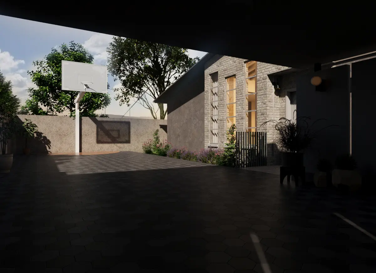 Sheltered court looking toward the entrance facade and basketball hoop.